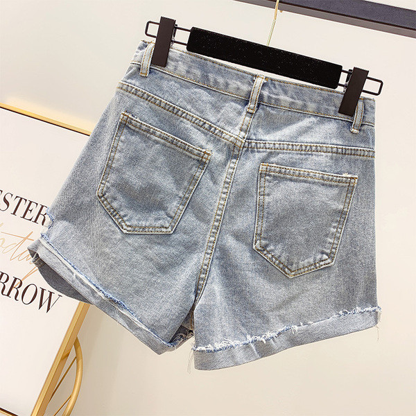 Blugi de dama moderni cu motive rupte