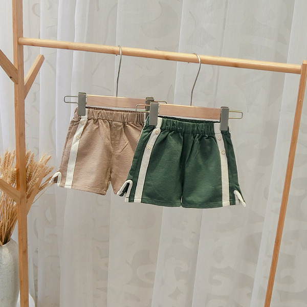 Alkalmi gyereknadrág fiúknak zöld és barna szegéllyel