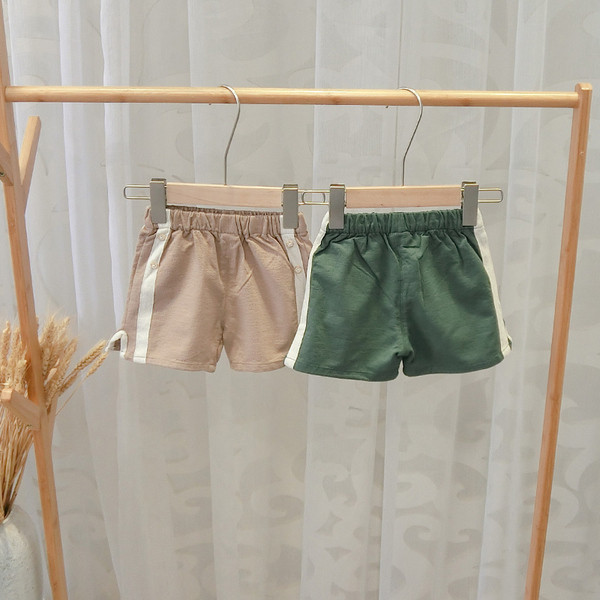 Alkalmi gyereknadrág fiúknak zöld és barna szegéllyel