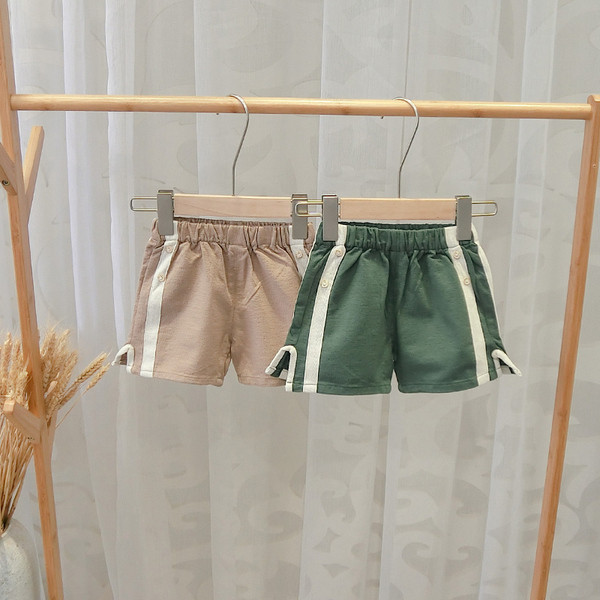 Alkalmi gyereknadrág fiúknak zöld és barna szegéllyel