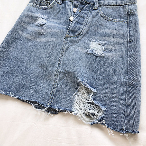 Női farmerszoknya magas derékkal, szakadt motívumokkal