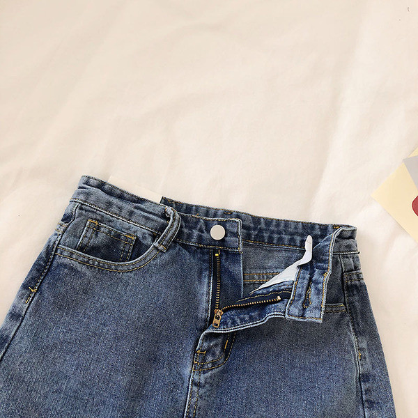 Női farmerszoknya magas derékkal, sötét színben