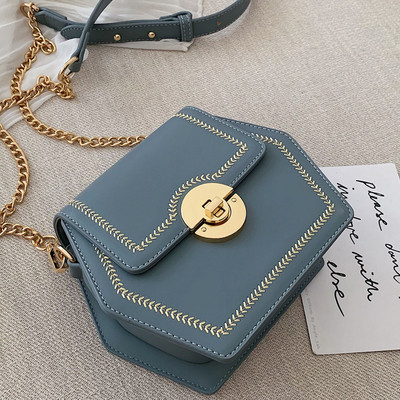 Geanta de dama din piele cu maner metalic