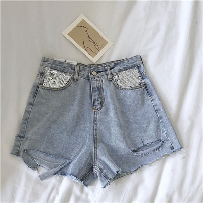 Pantaloni scurți de damă cu un element - paiete în două culori