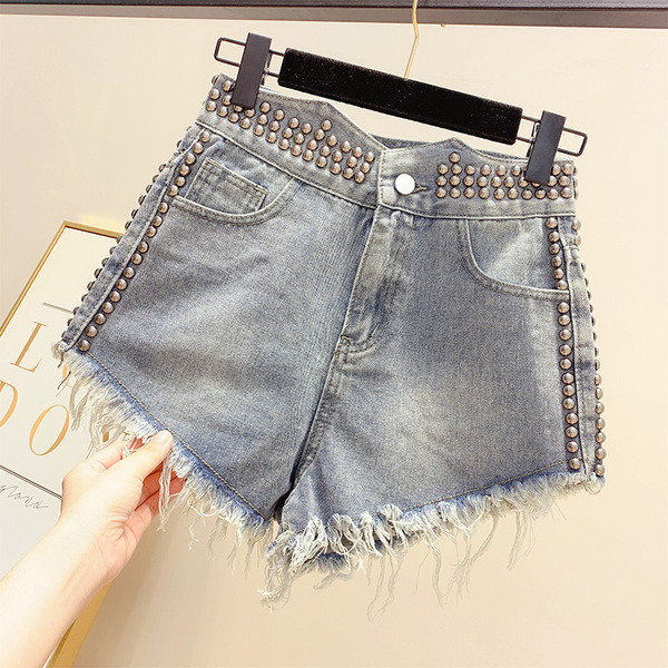 Pantaloni de damă moderni din denim cu decor cu ochiuri