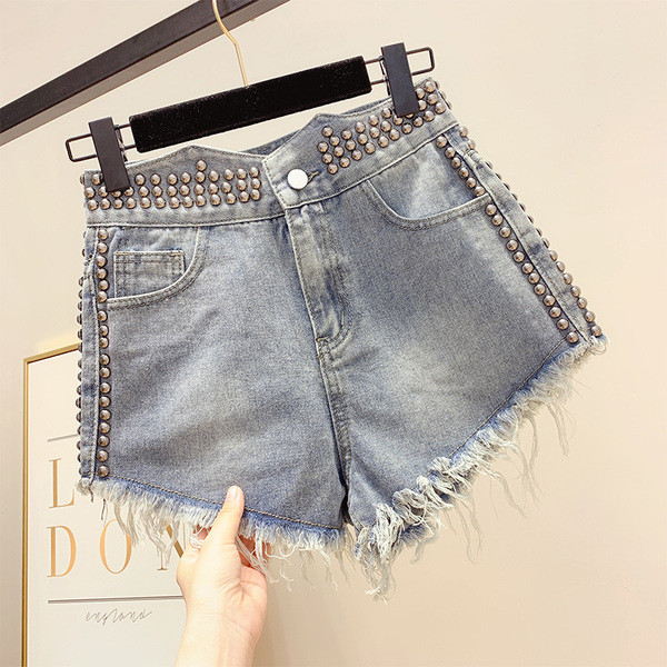 Pantaloni de damă moderni din denim cu decor cu ochiuri