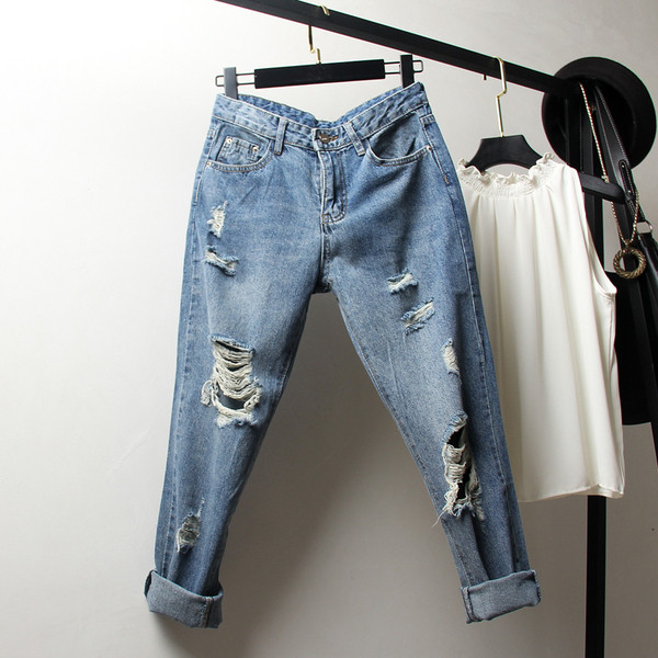 Blugi moderni de dama cu motive rupte in albastru