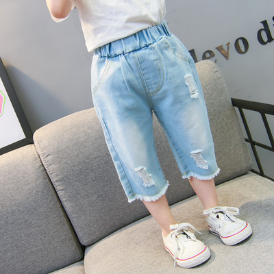 Szakadt motívumokkal és zsebekkel ellátott gyerekfarmer - lányoknak