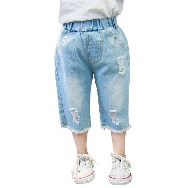 Szakadt motívumokkal és zsebekkel ellátott gyerekfarmer - lányoknak