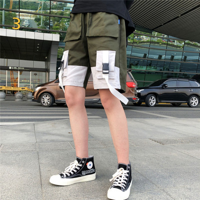 Férfi rövidnadrág új modellje fekete és zöld zsebekkel