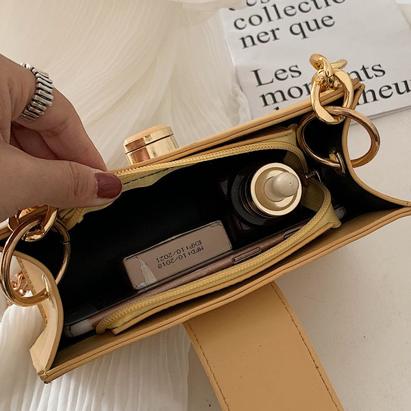 Elegáns női táska fém rögzítéssel több színben