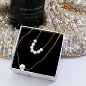 Modern női nyaklánc arany színű gyöngyökkel