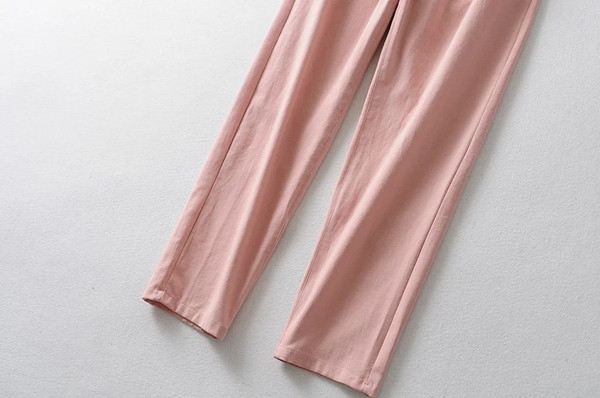 Rózsaszín női nadrág gumírozott derékkal és gombokkal