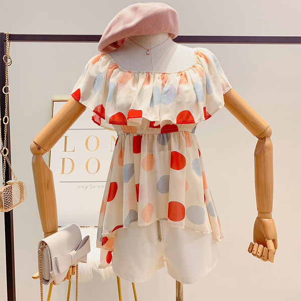 Bluză de damă asimetrică cu buline