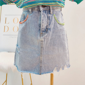 Női farmerszoknya szakadt motívumokkal, kék színben