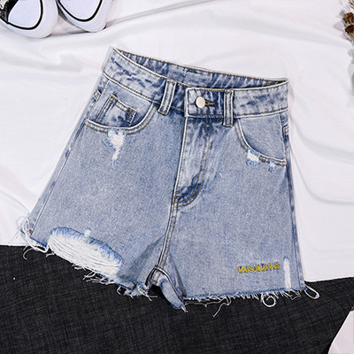 Lezser női rövidnadrág szakadt motívumokkal, kék színben