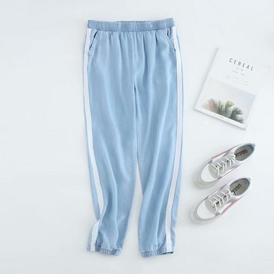 Pantaloni sport de damă cu elastic în talie și gleznă și margine laterală în albastru