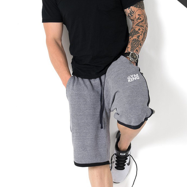 Férfi sportnadrág fekete, piros és szürke felirattal