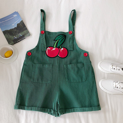 Μοντέρνα γυναικεία ολοσωμη φόρμα με κεντήματα και τσέπες σε μαύρο, λευκό και πράσινο χρώμα