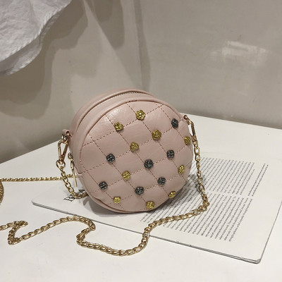 Geanta de dama in forma rotunda cu decor metalic