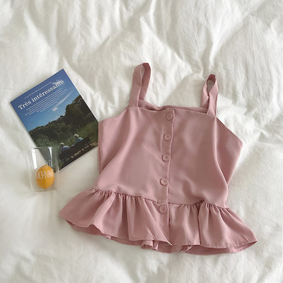 Stílusos női felső, vékony pántokkal és gombokkal, többféle színben