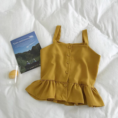 Stílusos női felső, vékony pántokkal és gombokkal, többféle színben