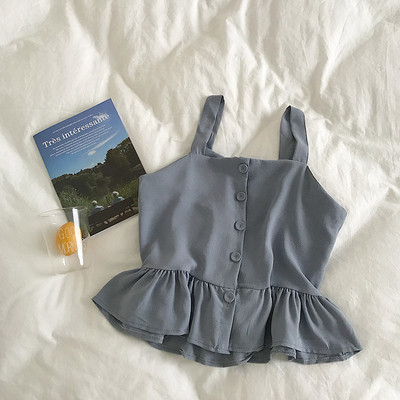 Stílusos női felső, vékony pántokkal és gombokkal, többféle színben