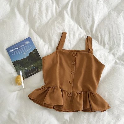 Stílusos női felső, vékony pántokkal és gombokkal, többféle színben