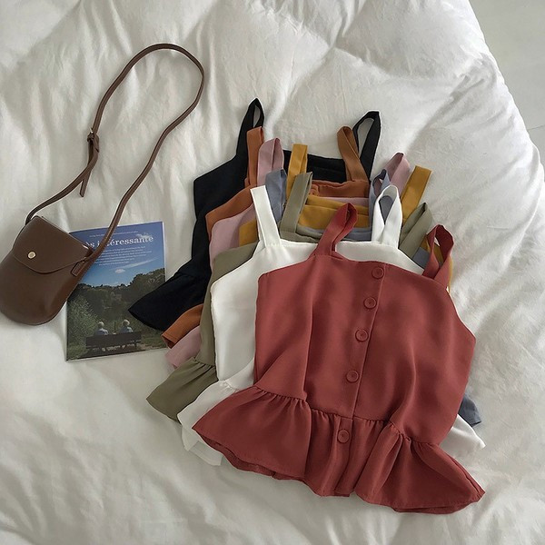 Stílusos női felső, vékony pántokkal és gombokkal, többféle színben