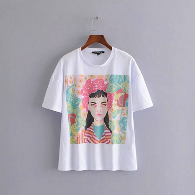 Női póló ovális nyakkivágással és rövid ujjú fehér színben, rátéttel