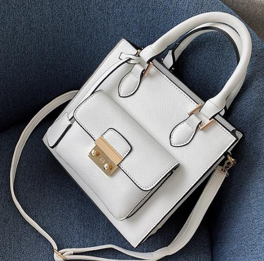 Modern női táska elülső zsebbel, négy színben