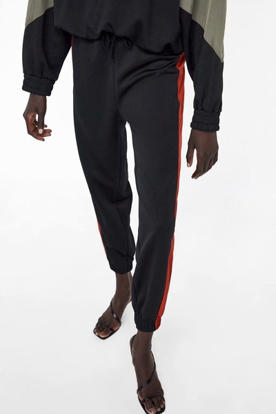 Pantaloni sport de damă cu elastic în talie și glezne și margine laterală