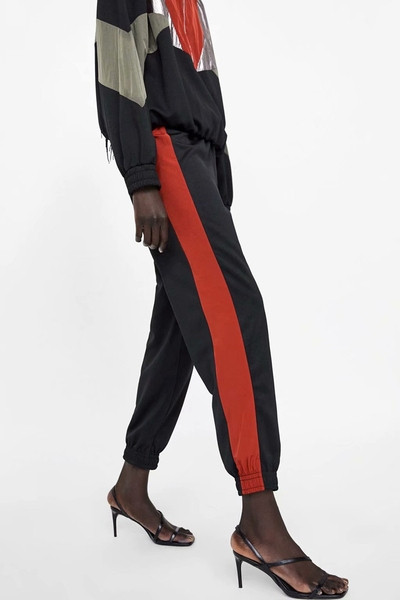 Pantaloni sport de damă cu elastic în talie și glezne și margine laterală