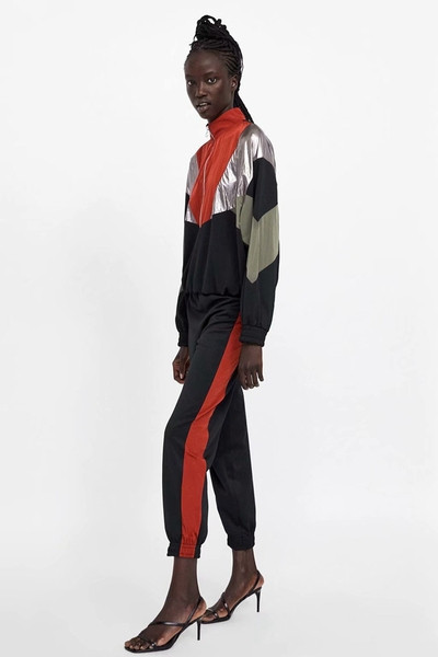 Pantaloni sport de damă cu elastic în talie și glezne și margine laterală