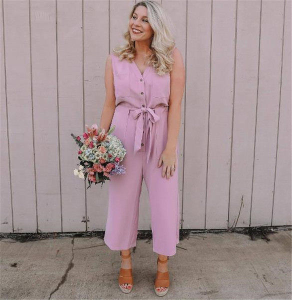 Salopetă casual de damă cu nasturi și curea roz