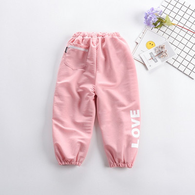 Pantaloni copii cu aplicatie si buzunar in mai multe culori - pentru fete