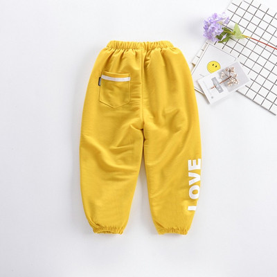 Pantaloni copii cu aplicatie si buzunar in mai multe culori - pentru fete