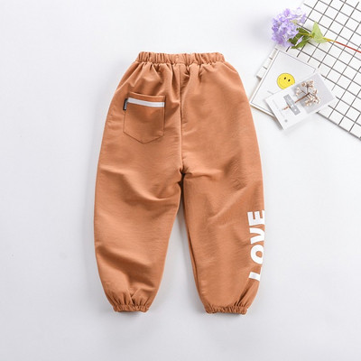 Pantaloni copii cu aplicatie si buzunar in mai multe culori - pentru fete