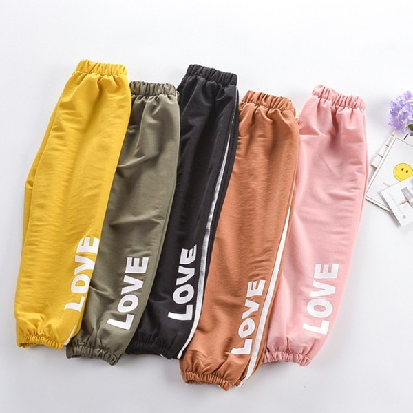 Pantaloni copii cu aplicatie si buzunar in mai multe culori - pentru fete