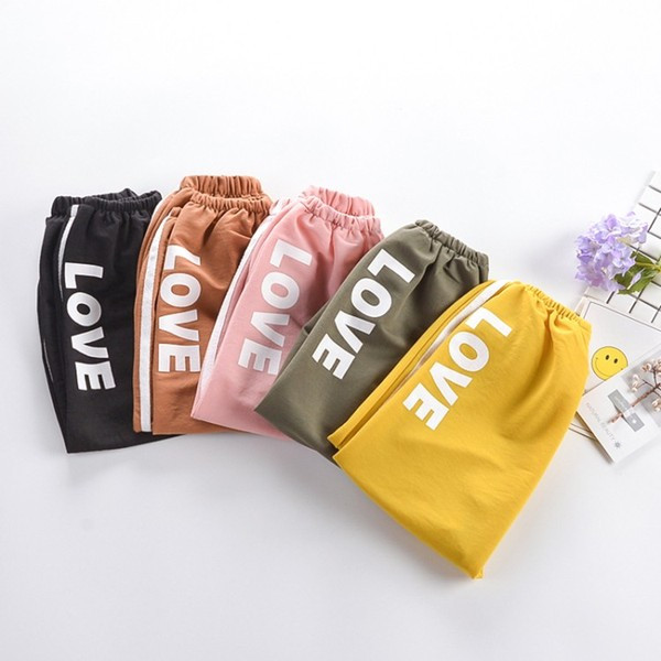 Pantaloni copii cu aplicatie si buzunar in mai multe culori - pentru fete