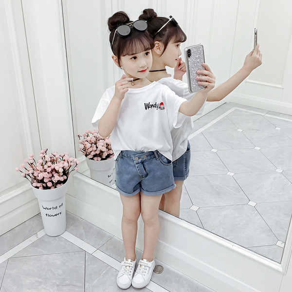 Lezser gyerekblúz lányoknak, rövid ujjú rátéttel, három színben