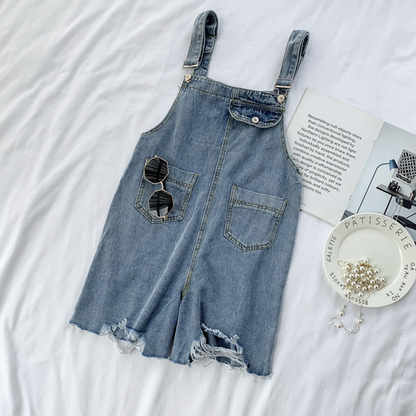 Salopetă casual de damă din denim, cu buzunar și motive rupte