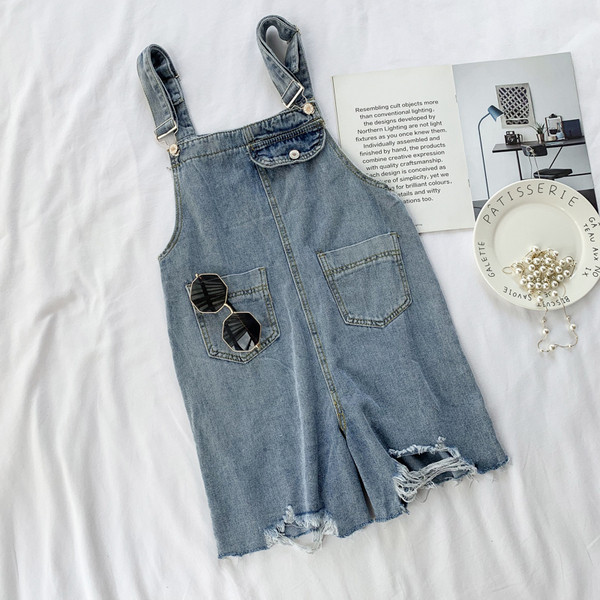 Salopetă casual de damă din denim, cu buzunar și motive rupte