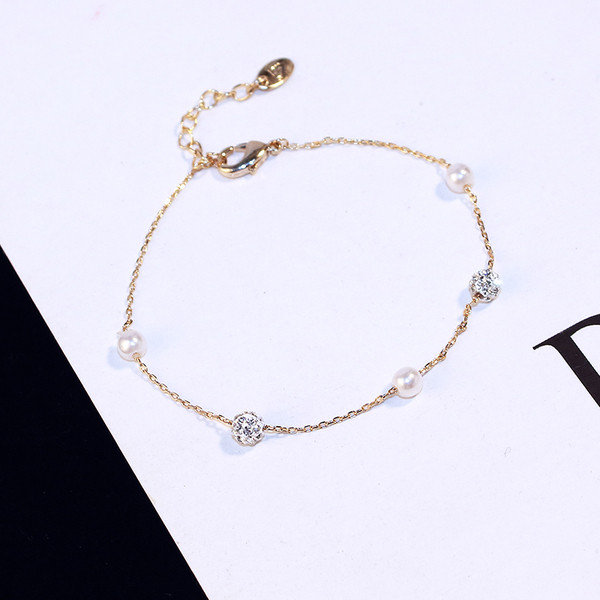 Brățară elegantă de damă, de culoare aurie, cu perle și pietre