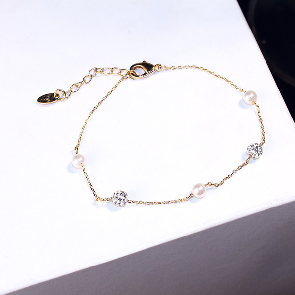 Brățară elegantă de damă, de culoare aurie, cu perle și pietre