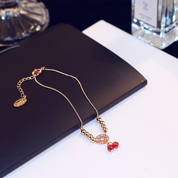 Bratara de dama de culoare aurie cu margele