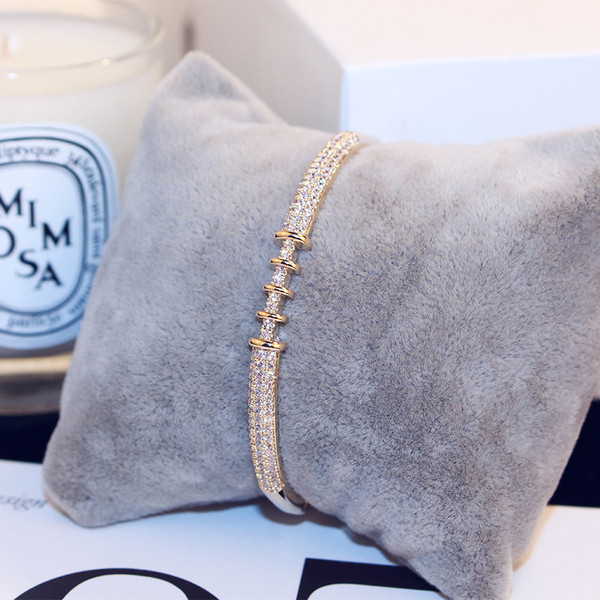 Brățară elegantă de damă în două culori cu pietre