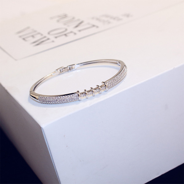 Brățară elegantă de damă în două culori cu pietre