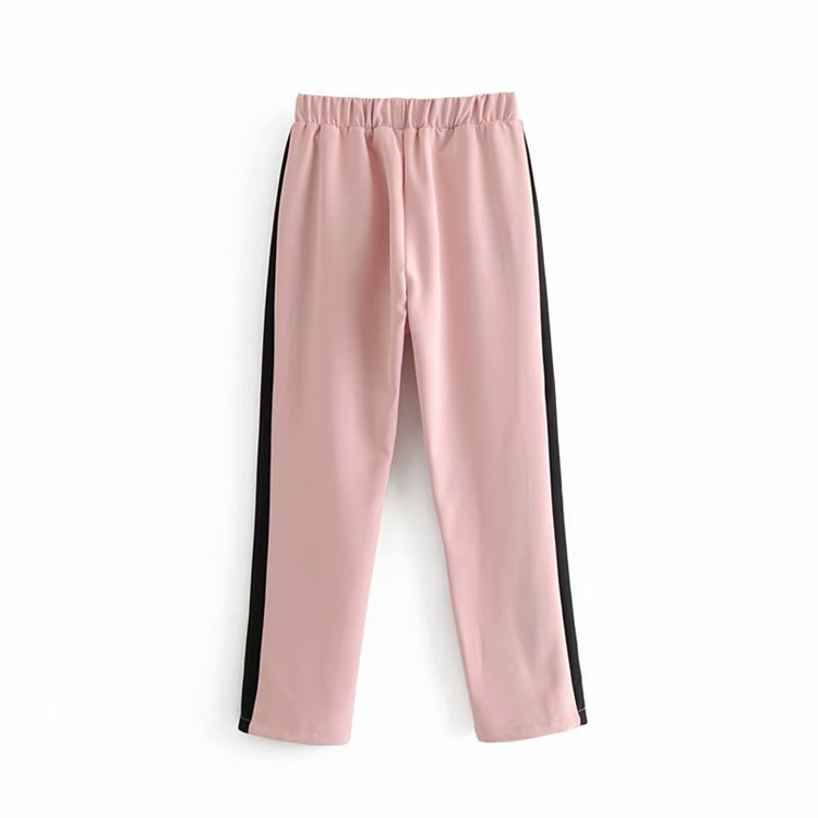Pantaloni de dama cu talie elastica de culoare roz si margine laterala