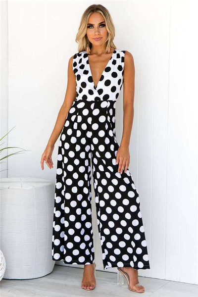 Salopetă de damă modernă de culoare neagră cu puncte și decolteu adânc